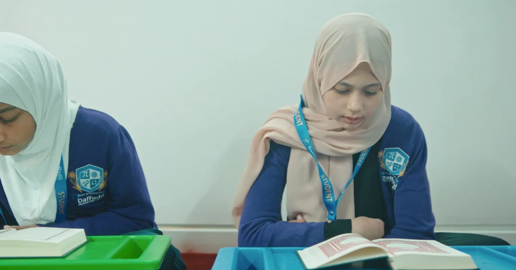 A teacher reading one to one with a pupil